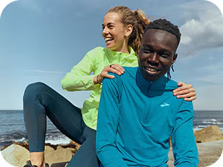 Two runners smiling